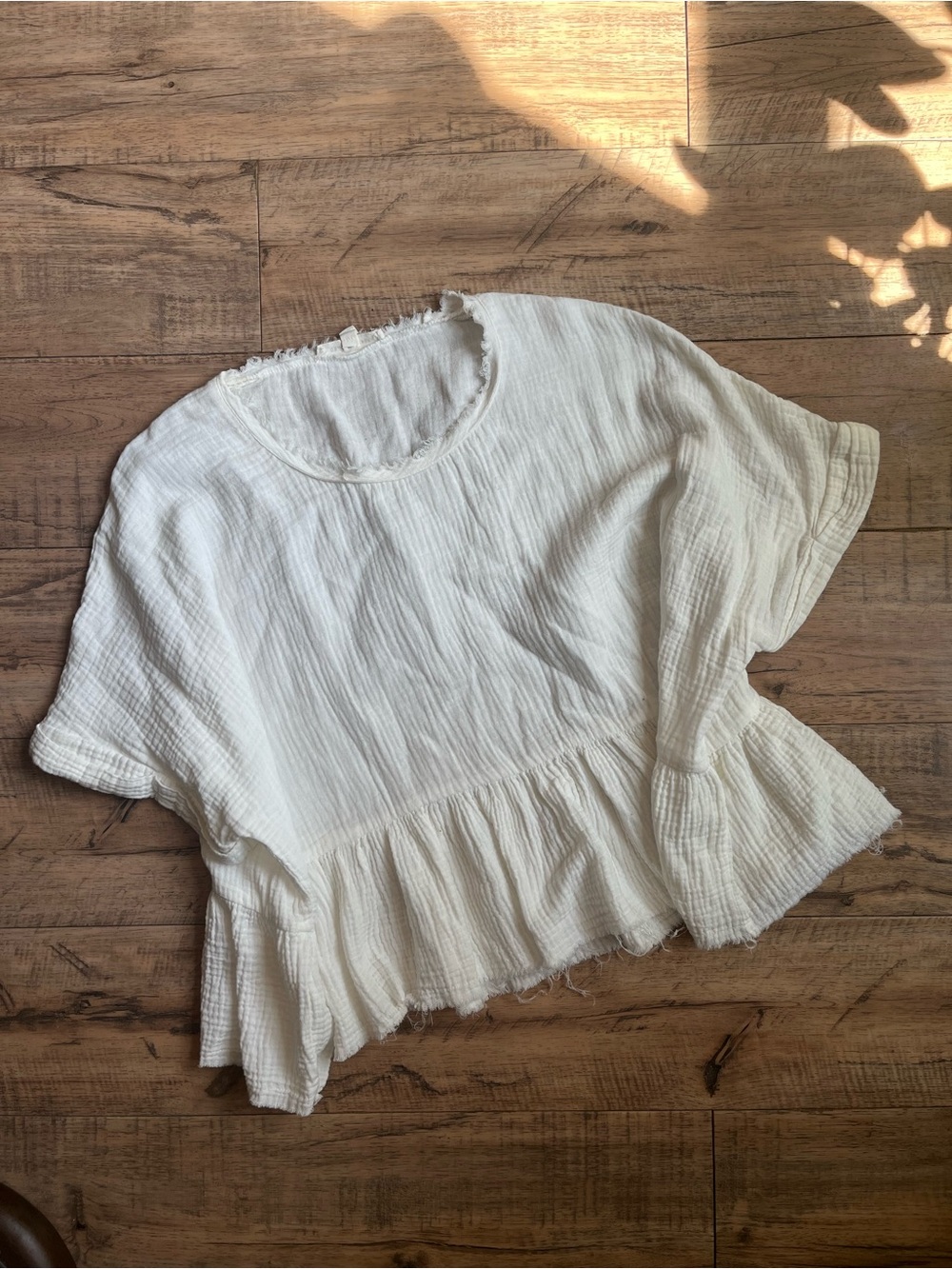 The Main Street Exchange Ivory Cotton Gauze Peplum Top